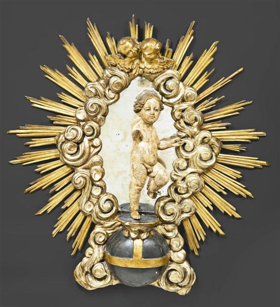 Appraisal: LARGE PAINTED SUN MIRROR WITH THE INFANT JESUS Baroque and