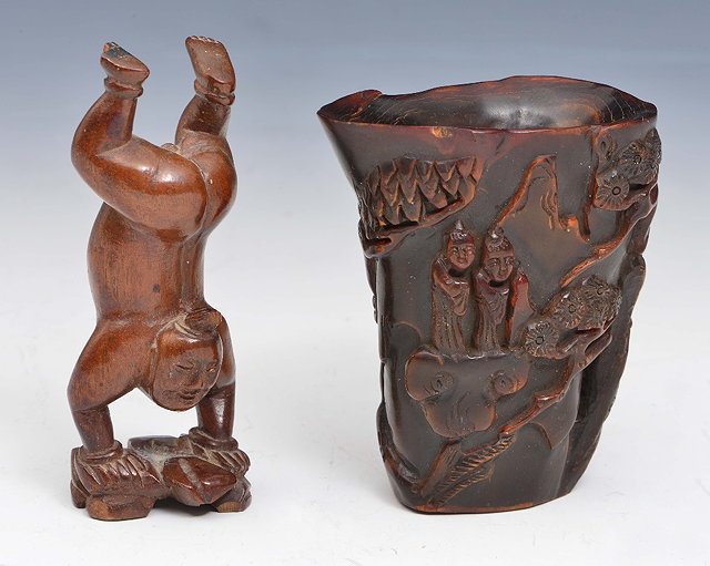 Appraisal: A CHINESE CARVED BUFFALO HORN LIBATION CUP with Daoist figures