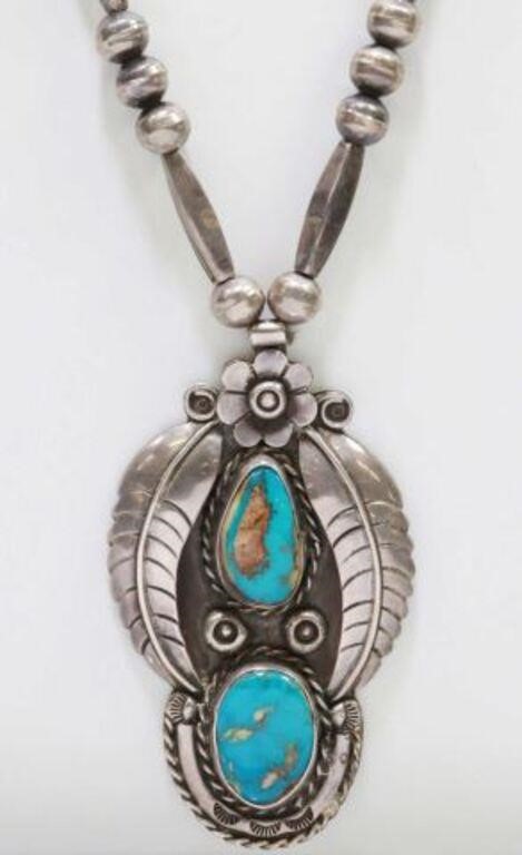 Appraisal: Southwest silver content unknown necklace pendant with two bezel-set turquoise