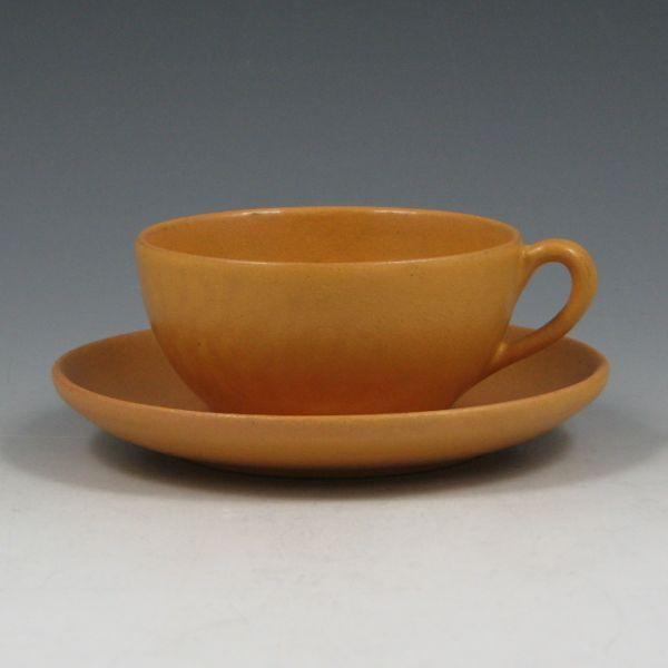 Appraisal: Paul Revere cup and saucer in semi-matte yellow glaze Marked