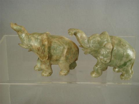 Appraisal: Pr carved jade elephants th c x Estimate -