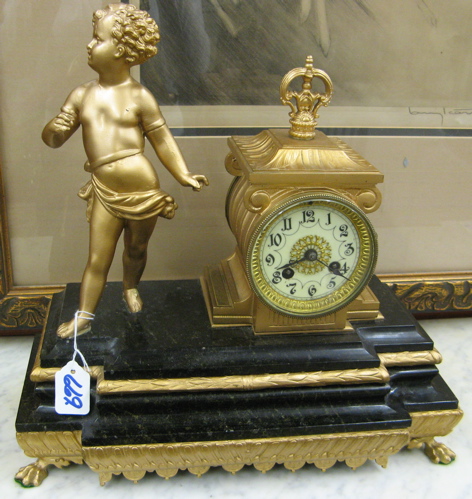 Appraisal: A FRENCH FIGURAL MANTEL SHELF CLOCK having time and bell