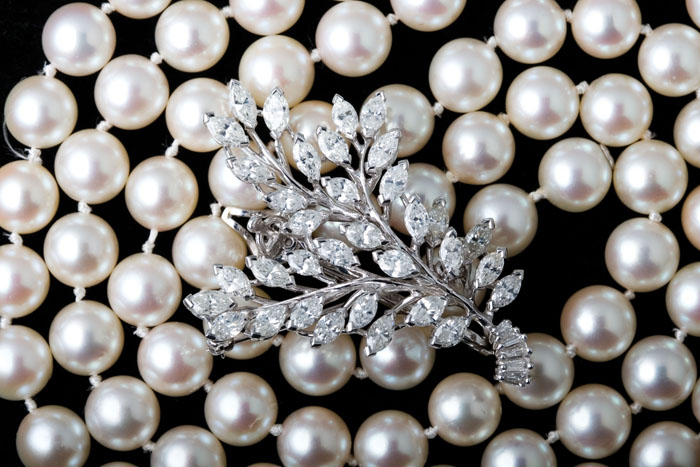 Appraisal: STRAND OF ROSE PEARLS WITH A DIAMOND CLASP The strand