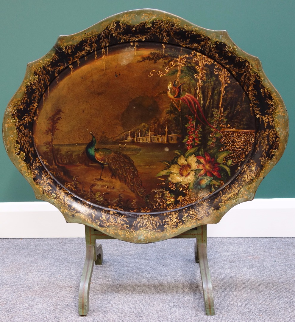 Appraisal: A Victorian papier mache tray painted with peacocks in a