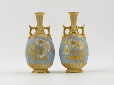 Appraisal: A pair of Royal Worcester vases decorated with large white