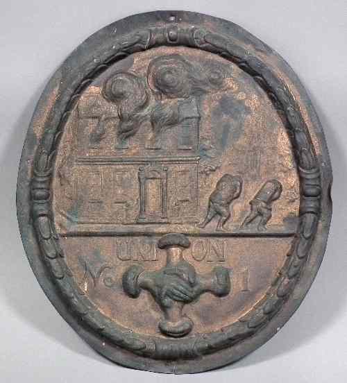 Appraisal: An embossed copper oval copy of a fire mark by