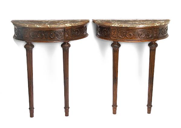 Appraisal: A pair of Louis XVI walnut consoles d'applique fourth quarter