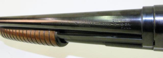 Appraisal: Winchester Model Slide Action ga Shotgun Blued Plain round barrel