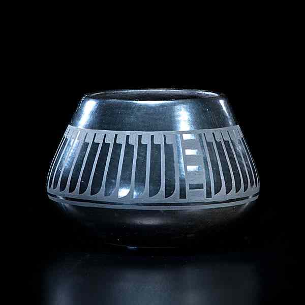 Appraisal: Blue Corn San Ildefonso Blackware Jar with negative feather motif