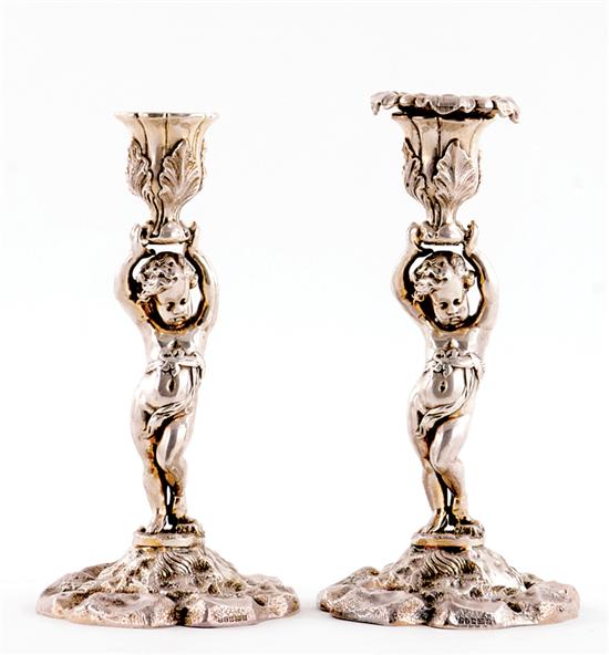 Appraisal: Pair French-style figural candleholders tulip-form bobeche supported by nude infant