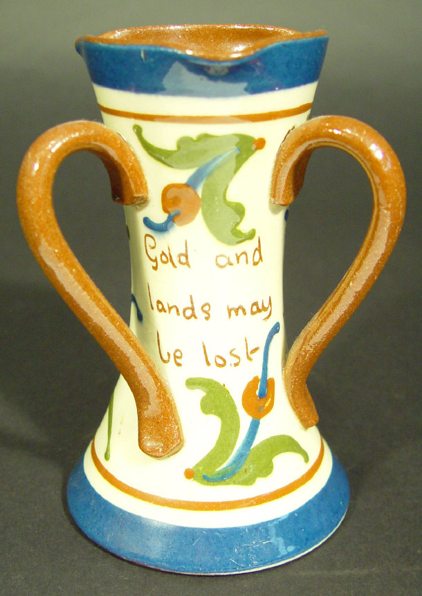 Appraisal: Torquay three handled vase incised with script and painted with