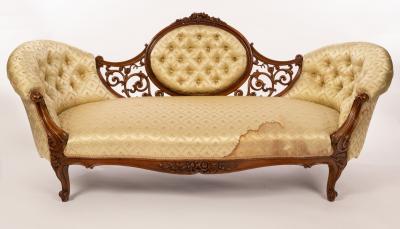 Appraisal: A Victorian two-chair back sofa deep buttoned with oval back