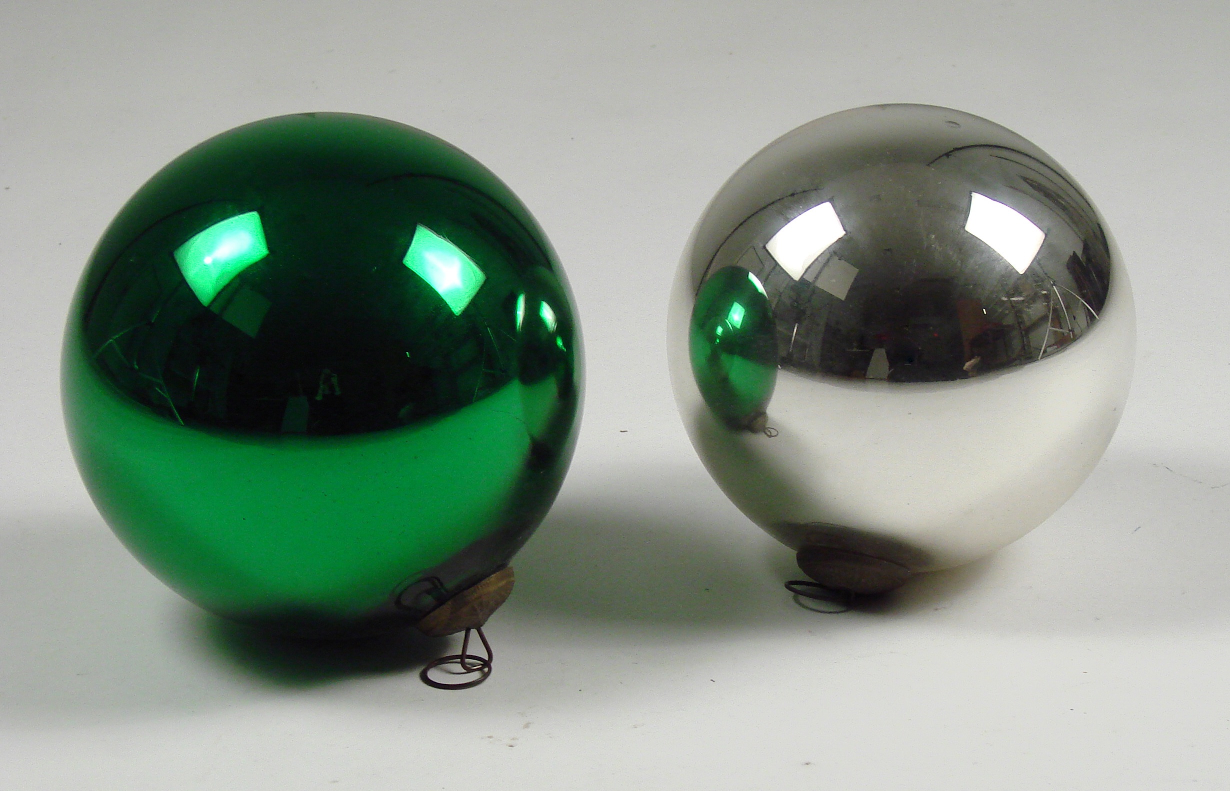 Appraisal: TWO LARGE MERCURY GLASS BALLS th CenturyOne silver and one