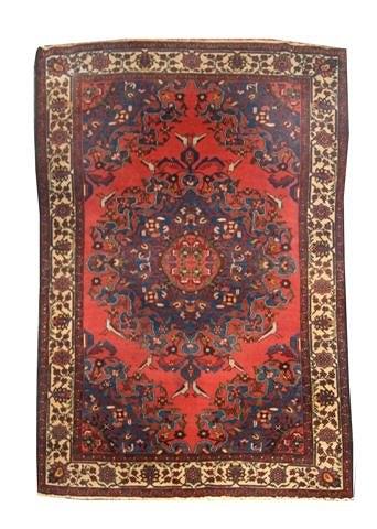 Appraisal: A TAFRISH RED GROUND RUG decorated a central complicated medallion