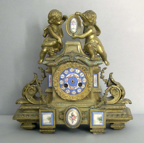 Appraisal: French gilt bronze mantle clock with hand painted porcelain mounts