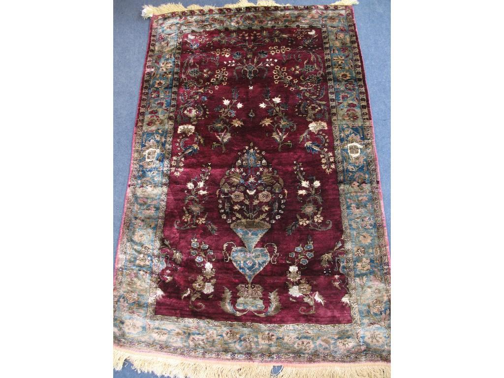 Appraisal: A KASHAN SILK RUG the central rectangular panel with a