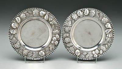 Appraisal: Pair French silver plates round with crimped rim repouss fruit