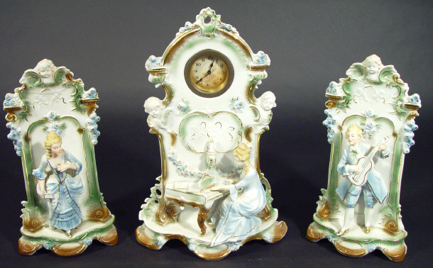 Appraisal: Continental china three piece clock garniture the central clock modelled