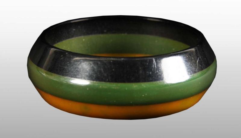 Appraisal: Bakelite Green Black Yellow Striped Bracelet Description Unusual Carved Condition