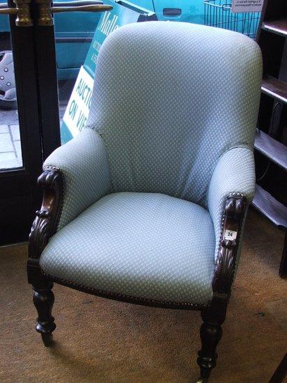 Appraisal: A WILLIAM IV ROSEWOOD LIBRARY CHAIR with shaped back scroll