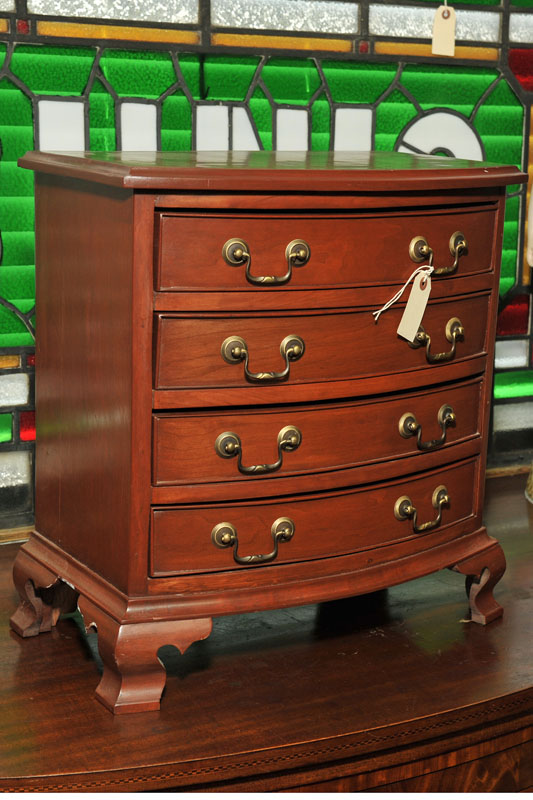 Appraisal: DIMINUTIVE CHEST OF DRAWERS Walnut bowfront chest having recessed drawers