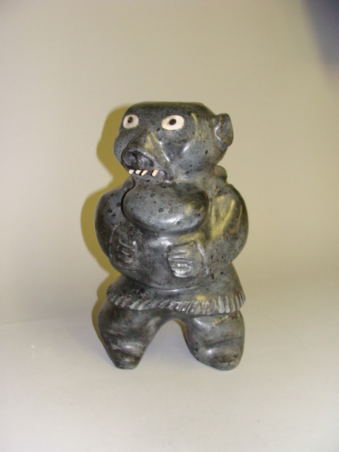 Appraisal: JUDAS ULLULAQ Inuit - Shaman eating bread H in