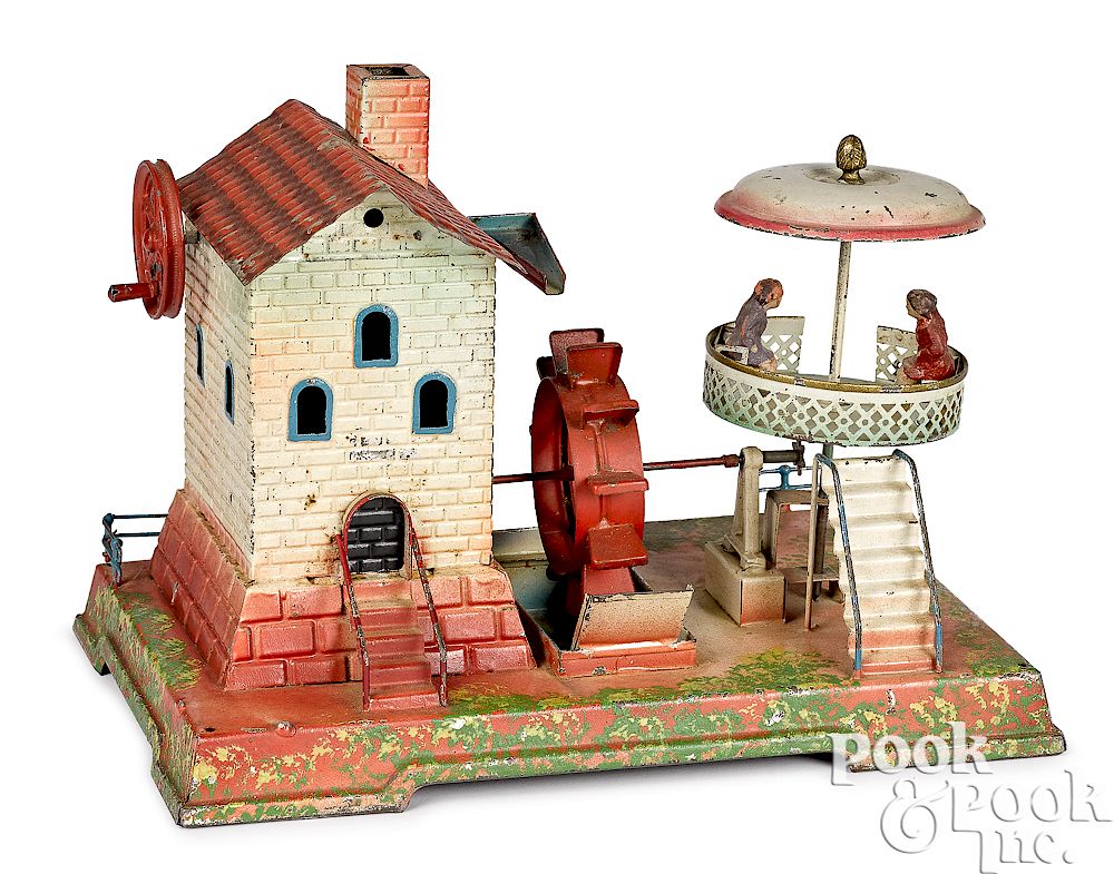 Appraisal: Painted and embossed tin mill steam toy accessory Painted and