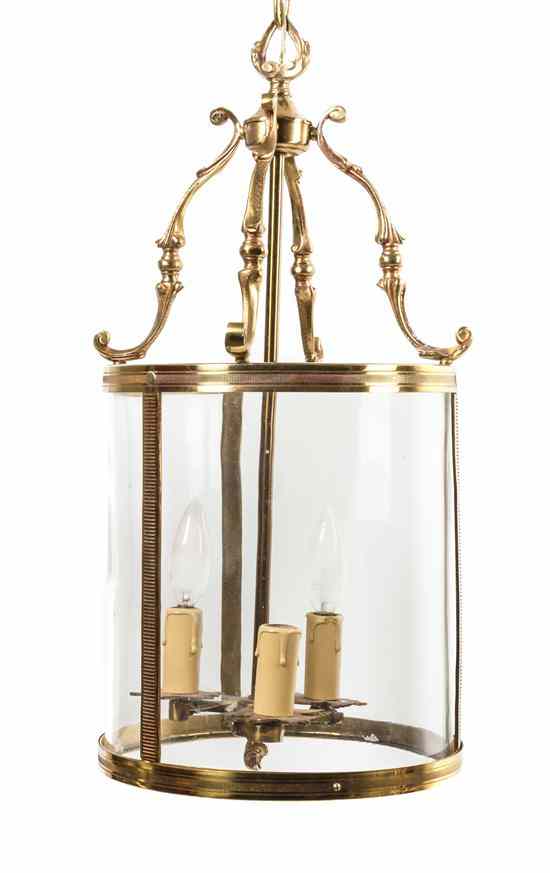 Appraisal: A Brass Three-Light Chandelier of birdcage form having a flame