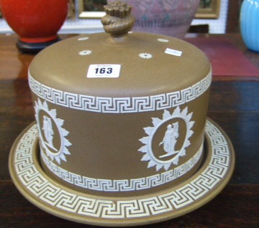 Appraisal: In the manner of Wedgwood a stoneware cheese dish and