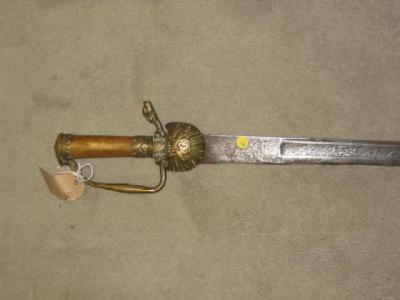 Appraisal: A HUNTING SWORD with brass shell and cannon langet brass