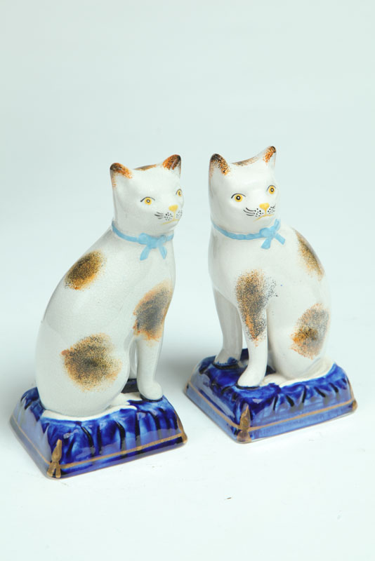 Appraisal: PAIR OF STAFFORDSHIRE CATS England nd quarter- th century Seated