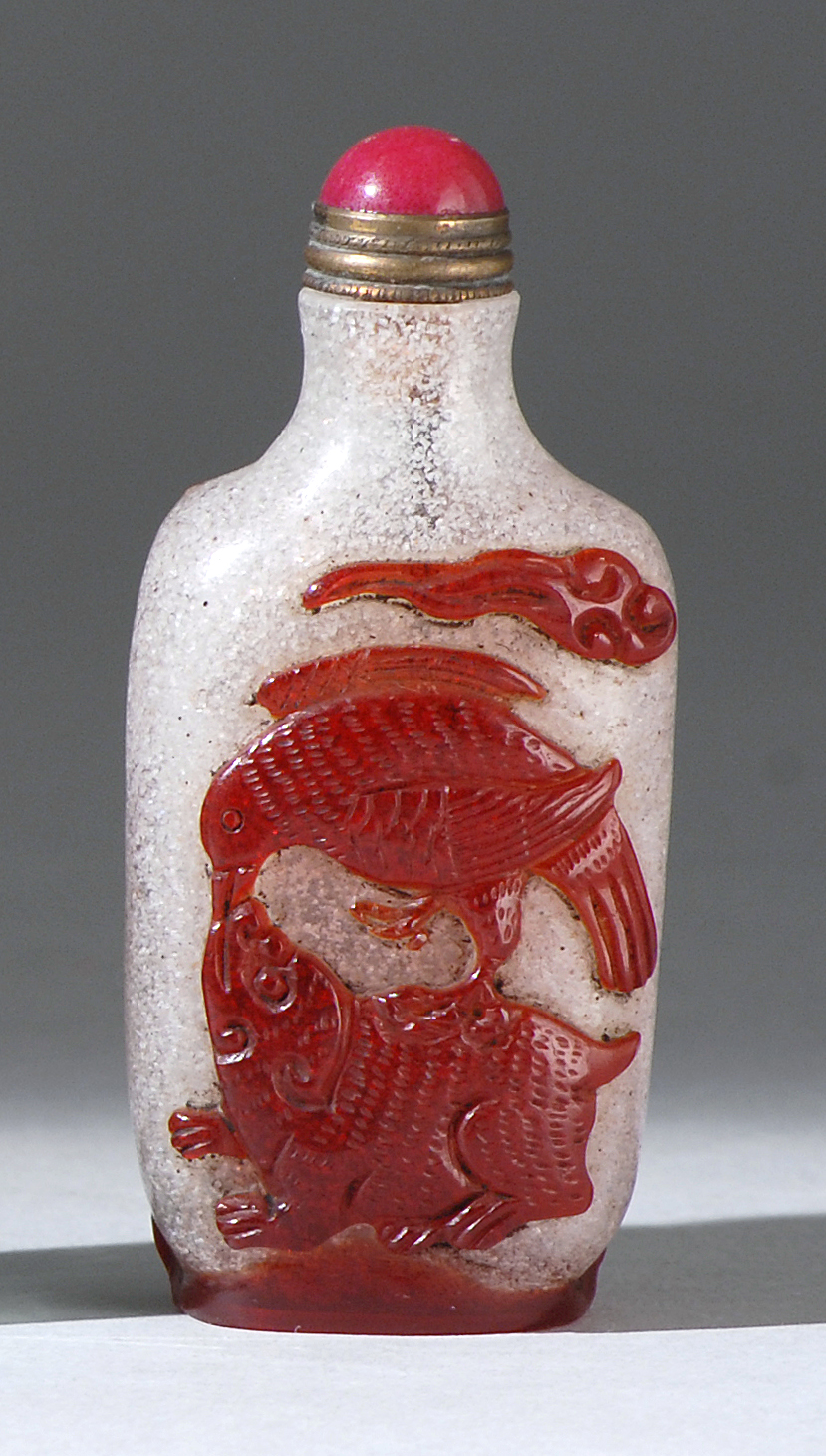 Appraisal: OVERLAY GLASS SNUFF BOTTLE In rectangular form With applied qilin