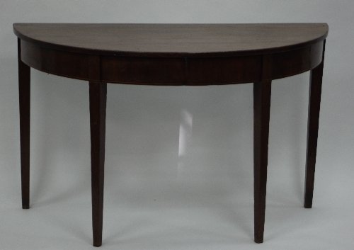 Appraisal: A George III mahogany semi circular table on square tapering