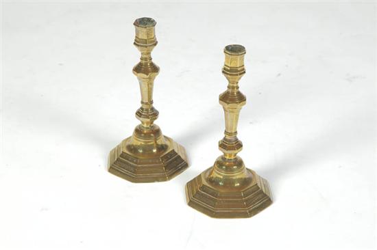 Appraisal: PAIR OF BRASS CANDLESTICKS France mid th century Paneled with