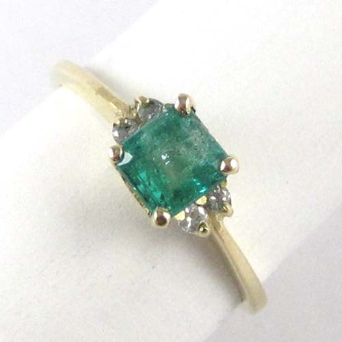 Appraisal: EMERALD DIAMOND AND FOURTEEN KARAT GOLD RING An emerald-cut green