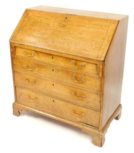 Appraisal: A thC oak bureau the fall flap above arrangement of