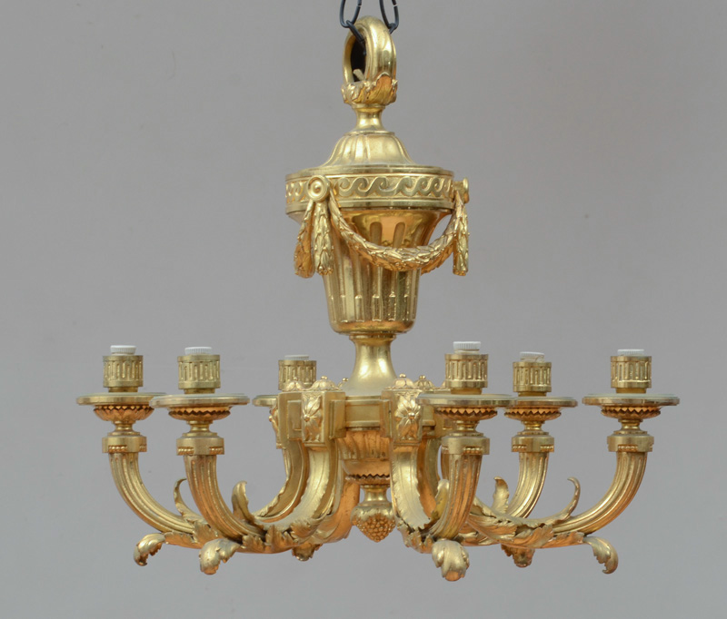 Appraisal: LOUIS XVI STYLE GILT-BRONZE SIX-LIGHT CHANDELIER The husk-hung fluted urn