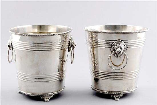 Appraisal: Pair silverplate wine coolers banded flaring form flanked by lion's