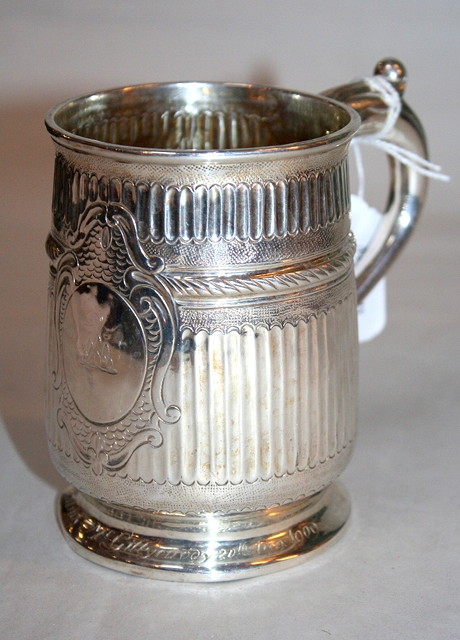 Appraisal: A GEORGIAN SILVER TANKARD with fluted decoration standing on a