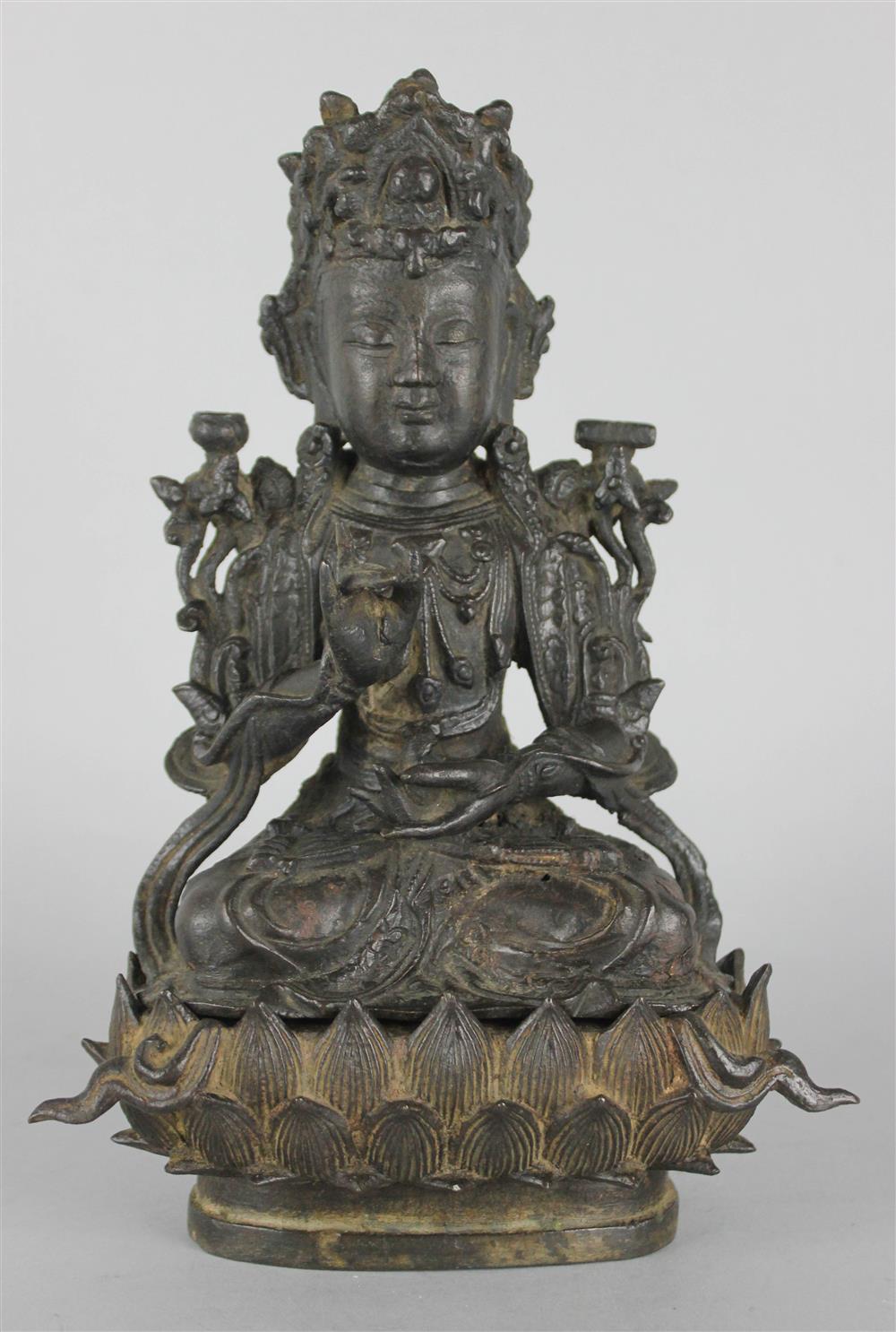 Appraisal: CHINESE PROVINCIAL BRONZE SEATED BUDDHA the Buddha Ming dynasty the