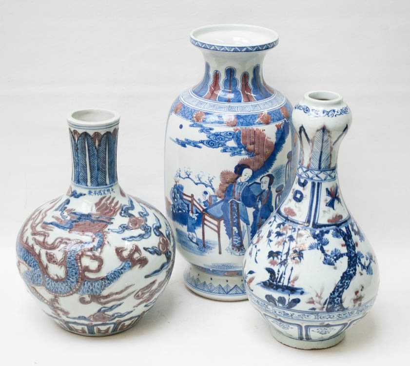 Appraisal: THREE CHINESE BLUE AND IRON RED PORCELAIN VASES the largest