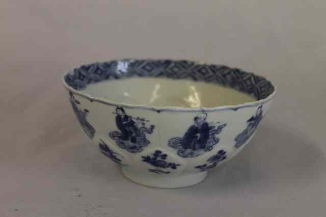 Appraisal: A CHINESE BLUE AND WHITE BOWL Kangxi petal moulded panels