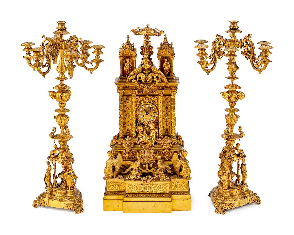 Appraisal: A French Gothic Revival Gilt Bronze Three-Piece Clock Garniture A