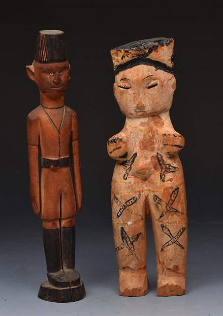 Appraisal: AN EAST AFRICAN CARVED WOODEN FIGURE of a native soldier