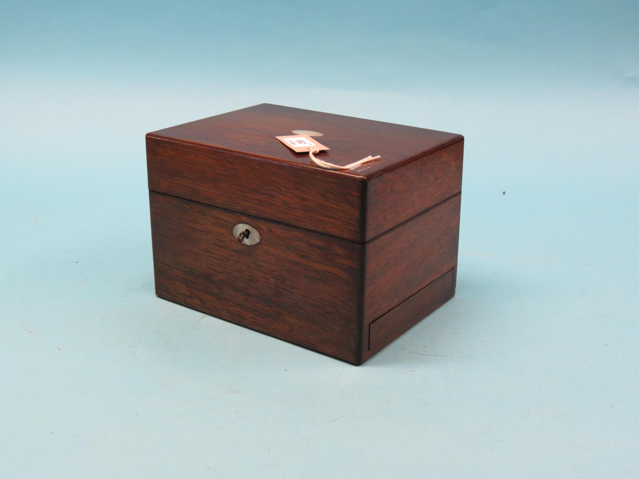 Appraisal: A Victorian rosewood vanity case fitted interior complete with glass