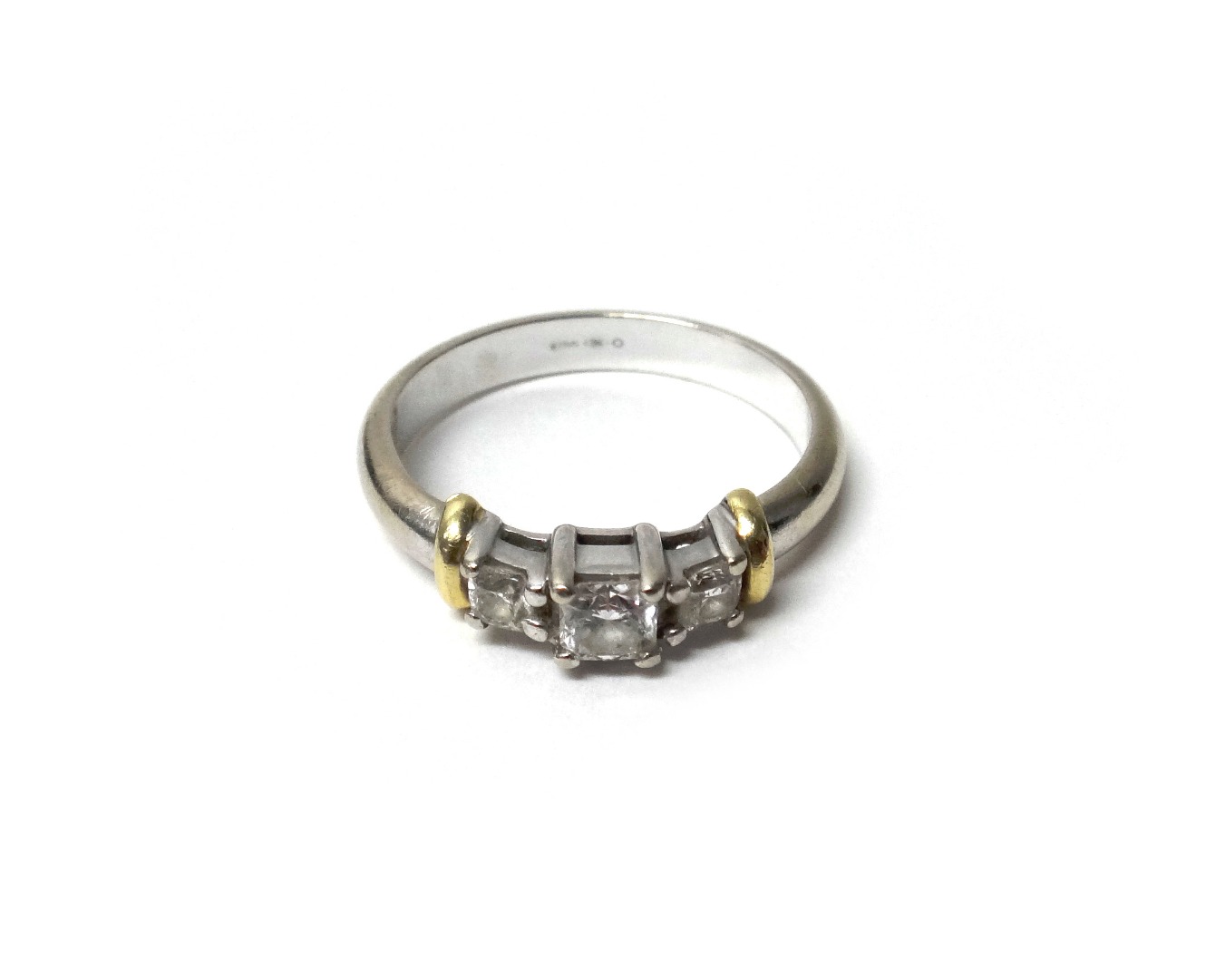 Appraisal: A white gold and diamond set three stone ring claw