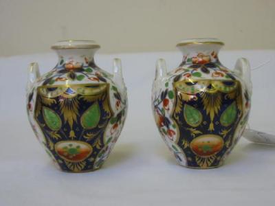 Appraisal: A PAIR OF DERBY PORCELAIN MINIATURE VASES of urn form