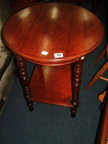 Appraisal: A Victorian walnut circular occasional table with turned supports diameter