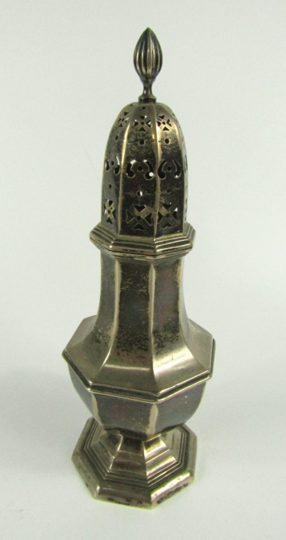 Appraisal: An Edwardian silver octagonal silver caster of tapering baluster design