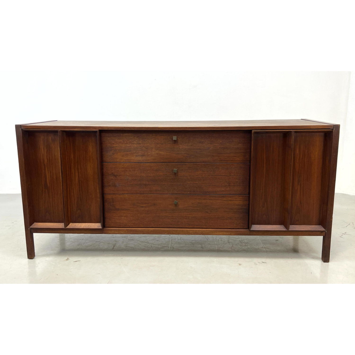 Appraisal: DANIEL JONES Walnut American Modern Credenza Dimensions H inches W